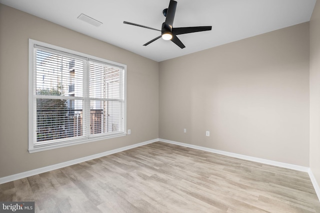 spare room featuring ceiling fan and light wood-type flooring