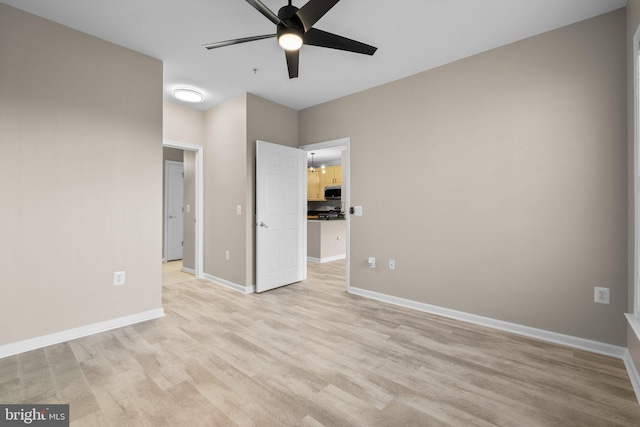 unfurnished bedroom featuring ceiling fan and light wood-type flooring