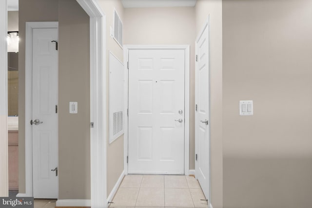 hallway with light tile patterned floors