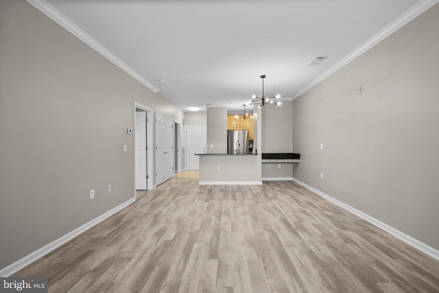 unfurnished living room with light wood-type flooring, ornamental molding, and a chandelier