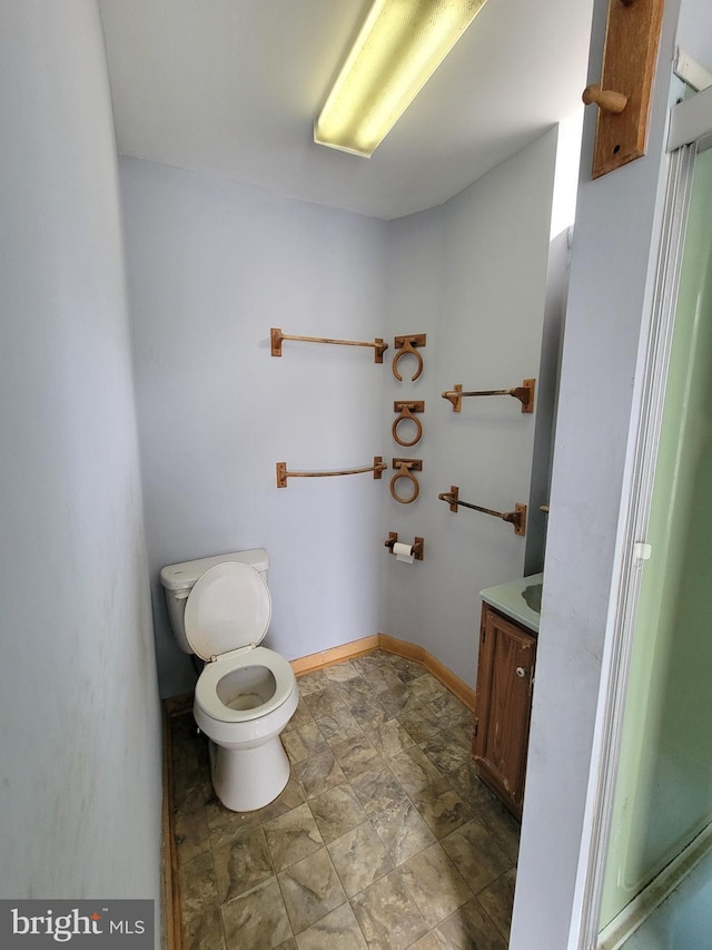 bathroom with toilet and vanity