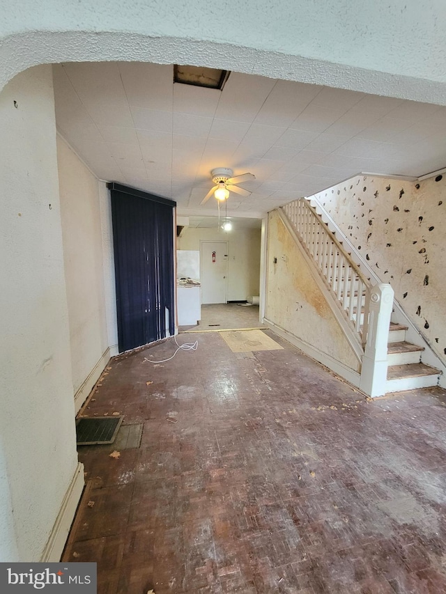 interior space featuring ceiling fan