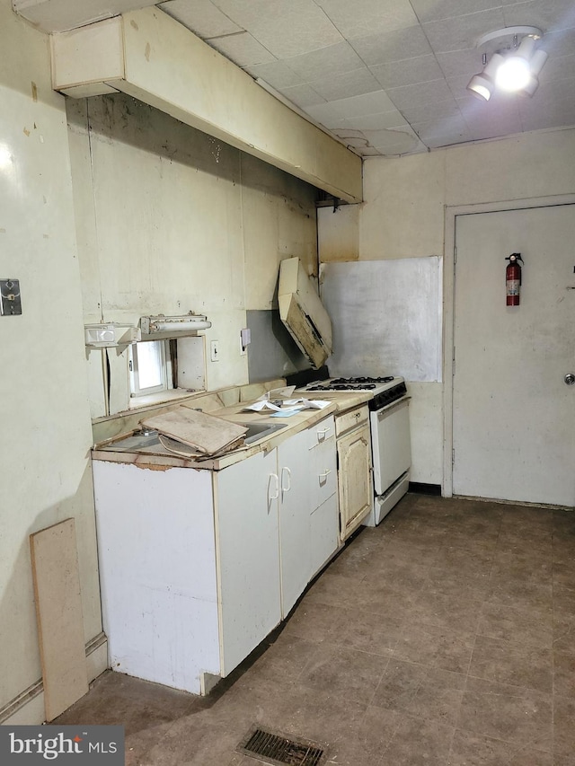 kitchen featuring white gas range