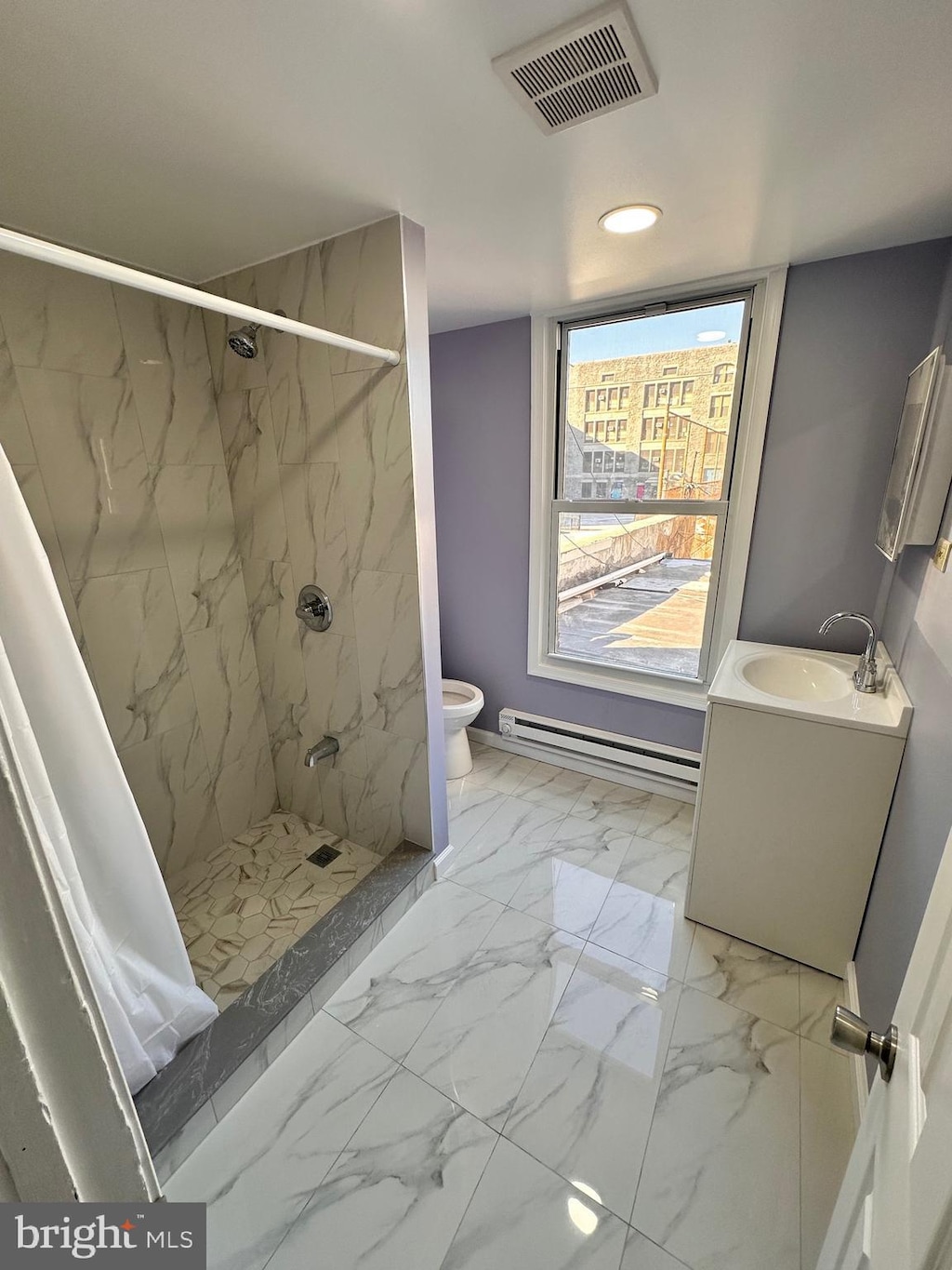 bathroom with toilet, a baseboard radiator, vanity, and a shower with curtain