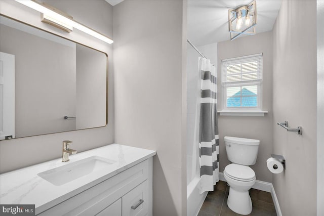 bathroom with toilet, tile patterned floors, and vanity