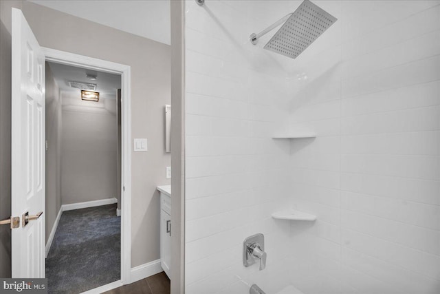 bathroom featuring shower / bathtub combination and vanity