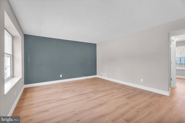 unfurnished room with light hardwood / wood-style flooring