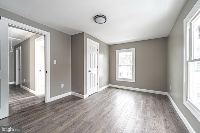 empty room featuring dark wood-type flooring