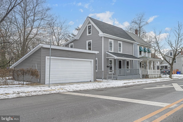 view of front facade featuring covered porch and a garage