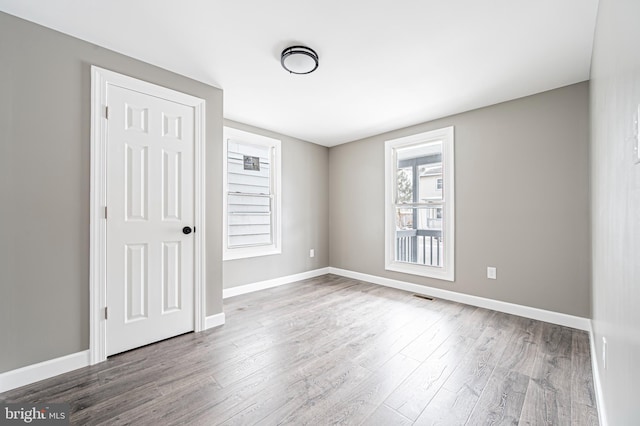 spare room featuring hardwood / wood-style floors