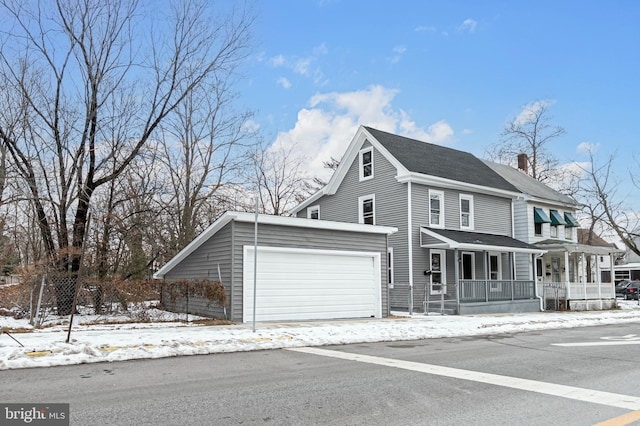 view of front of property with a porch and a garage