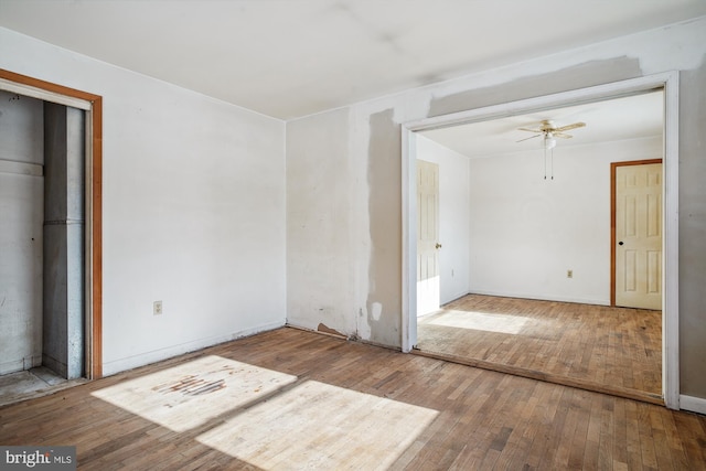 unfurnished room with ceiling fan and hardwood / wood-style floors