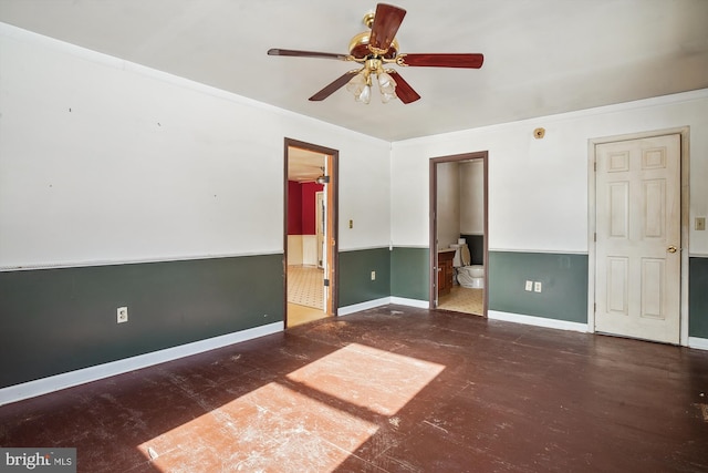 empty room with ceiling fan and ornamental molding