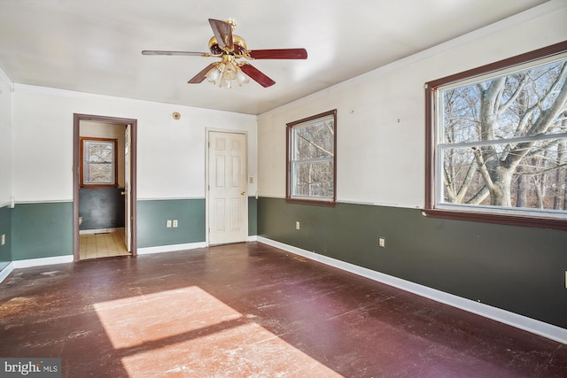 unfurnished bedroom with ceiling fan and connected bathroom