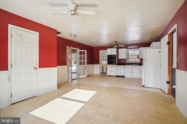 kitchen featuring ceiling fan, white cabinets, and white appliances