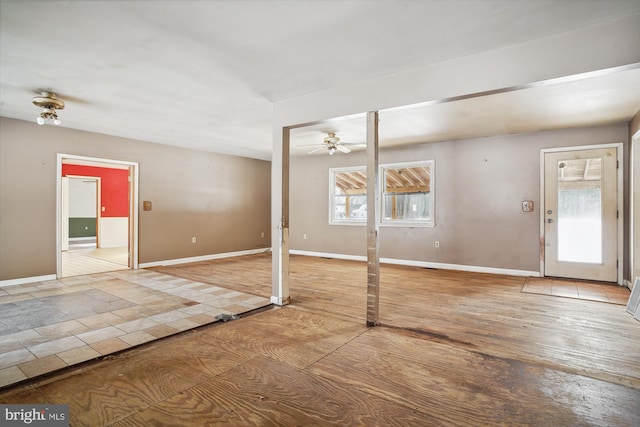 foyer entrance featuring ceiling fan and a healthy amount of sunlight