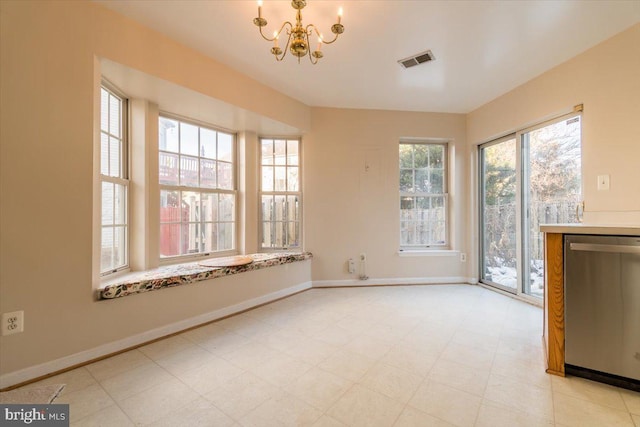 unfurnished dining area featuring an inviting chandelier