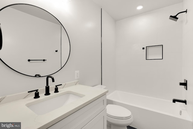 full bathroom featuring toilet, vanity, and  shower combination