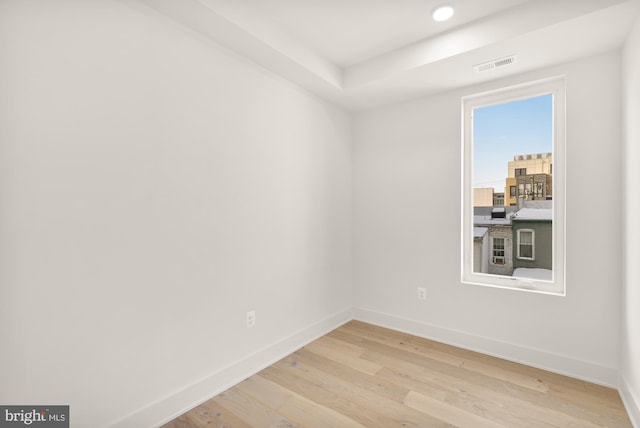 spare room featuring light hardwood / wood-style floors