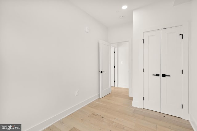 hall with light hardwood / wood-style floors