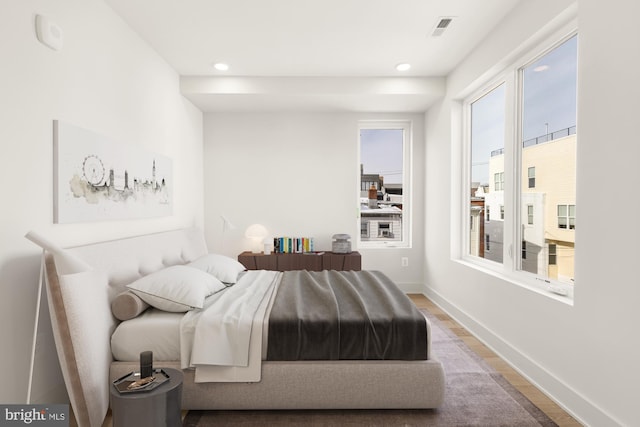 bedroom with wood-type flooring