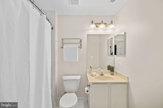 bathroom with toilet, vanity, tile patterned floors, and curtained shower