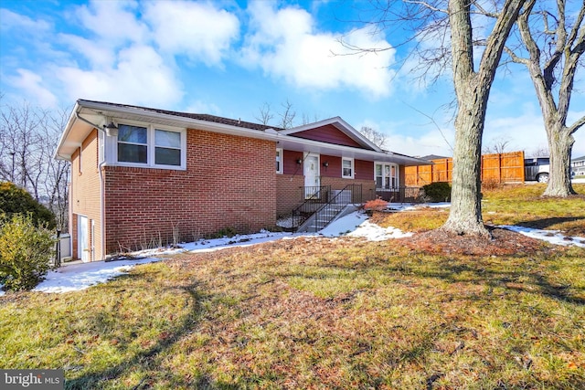 single story home with a front yard and a garage