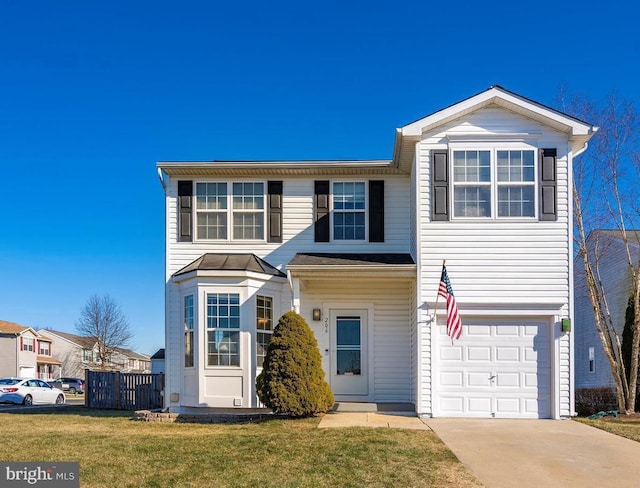 view of front property featuring a front yard and a garage