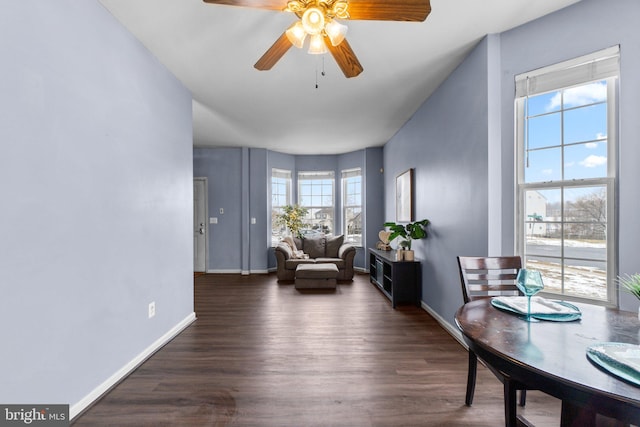 sitting room with ceiling fan and dark hardwood / wood-style floors