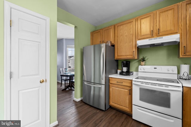 kitchen with electric stove, dark hardwood / wood-style floors, and stainless steel refrigerator