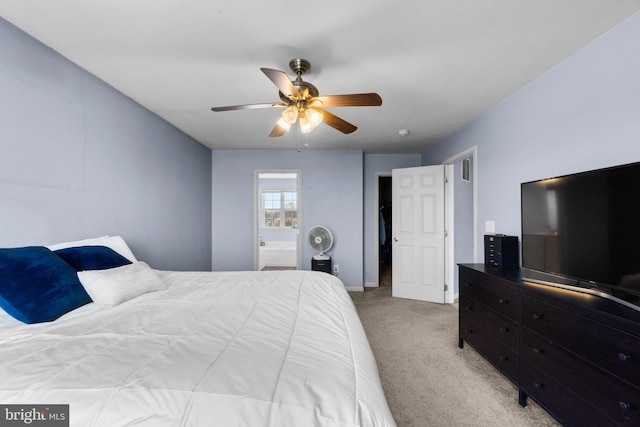 carpeted bedroom with ceiling fan and ensuite bathroom