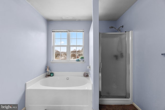 bathroom with separate shower and tub