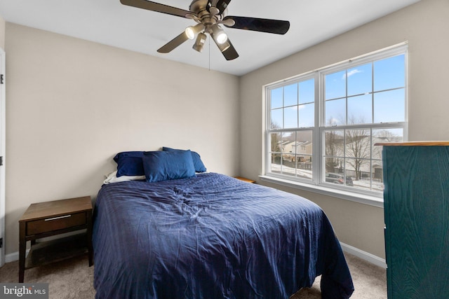 bedroom with ceiling fan and carpet