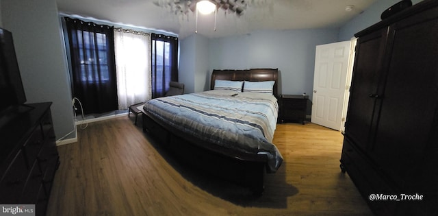 bedroom with wood-type flooring