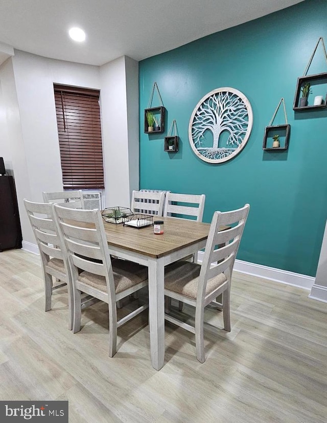 dining area with light wood-type flooring