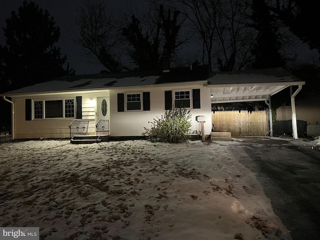 single story home featuring a carport