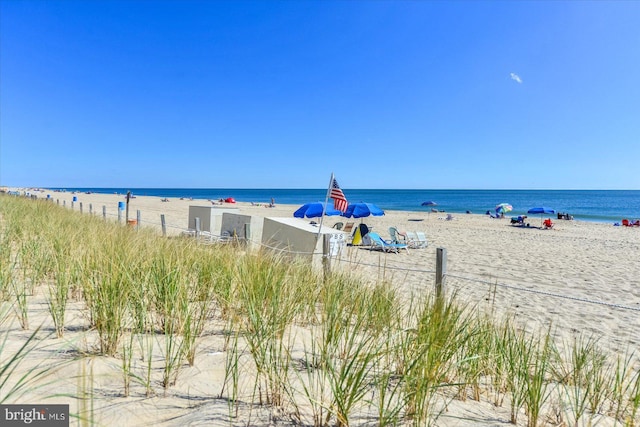 property view of water featuring a beach view