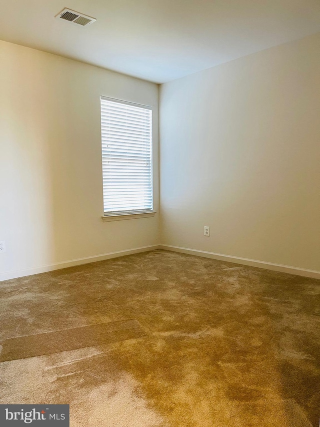 empty room with carpet flooring