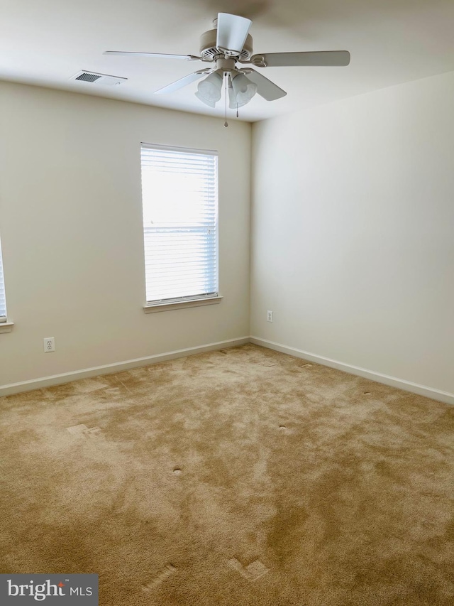 carpeted empty room with ceiling fan