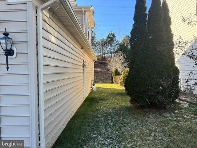 view of property exterior featuring a yard