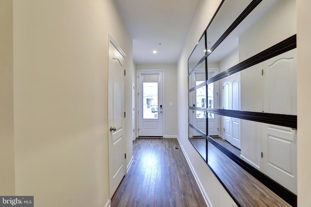 entryway with dark wood-type flooring