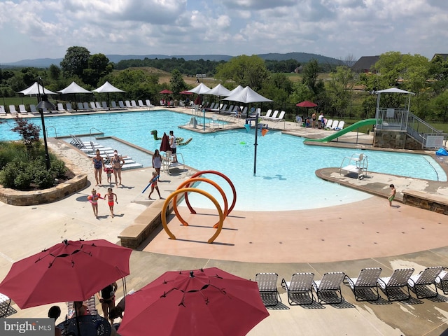 view of swimming pool with a patio