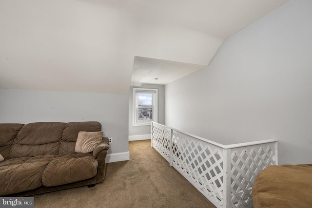 living area featuring lofted ceiling and carpet flooring