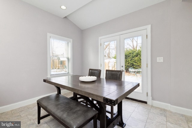 dining area featuring lofted ceiling, french doors, recessed lighting, and baseboards