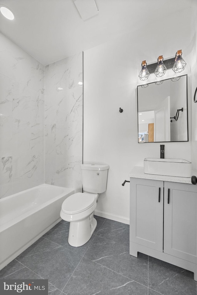 full bathroom with toilet, vanity, and tiled shower / bath combo