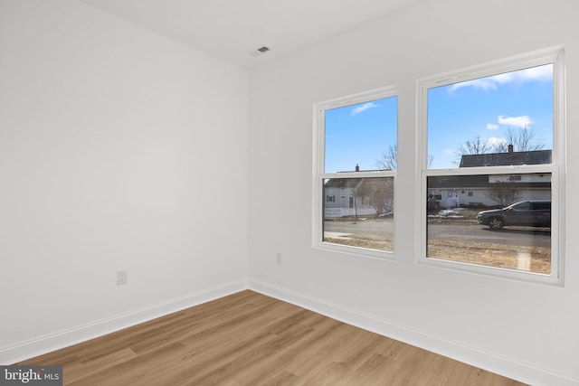 empty room featuring hardwood / wood-style floors