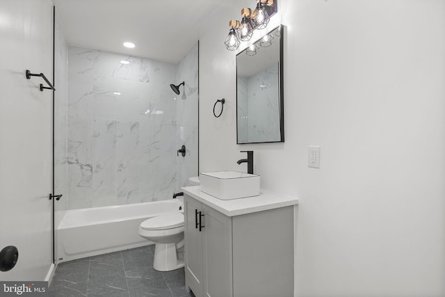 full bathroom with toilet, vanity, and tiled shower / bath combo