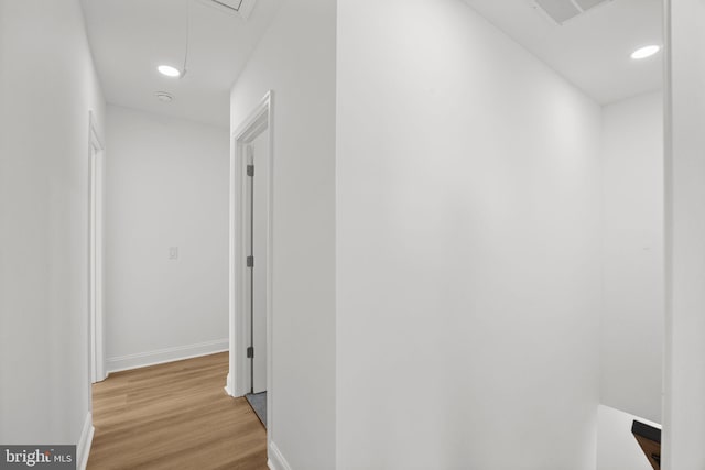 corridor with light hardwood / wood-style flooring