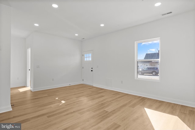 unfurnished room featuring light hardwood / wood-style flooring