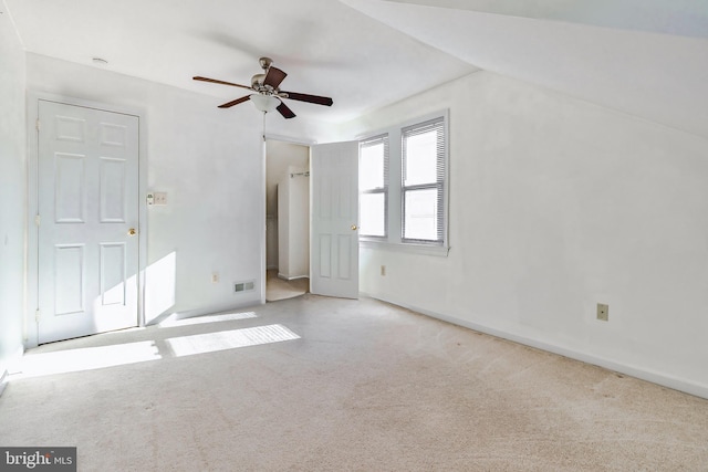 interior space featuring ceiling fan and lofted ceiling